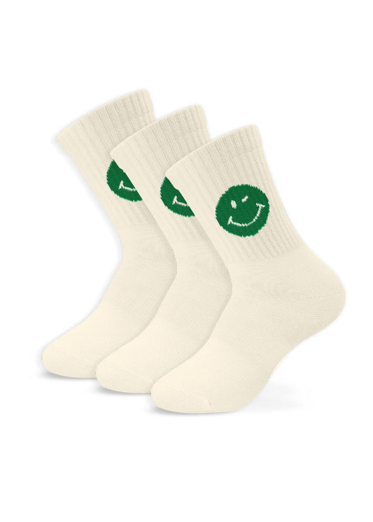 J.Clay 3er-Pack cremefarbene, gerippte Kindersocken mit grünem Smile-Motiv und einem aufgestickten Lächeln an der Seite. Alle Paare sind fein säuberlich nebeneinander auf weißem Hintergrund angeordnet.