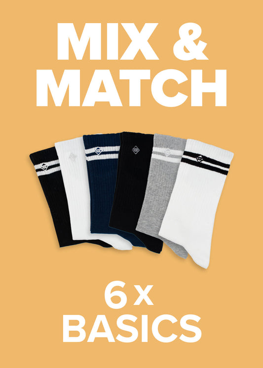 Sparen Sie bei „J.Clay Mix  Match“ – 6 „Basics“-Socken in 4 Farben, dargestellt auf gelbem Hintergrund.