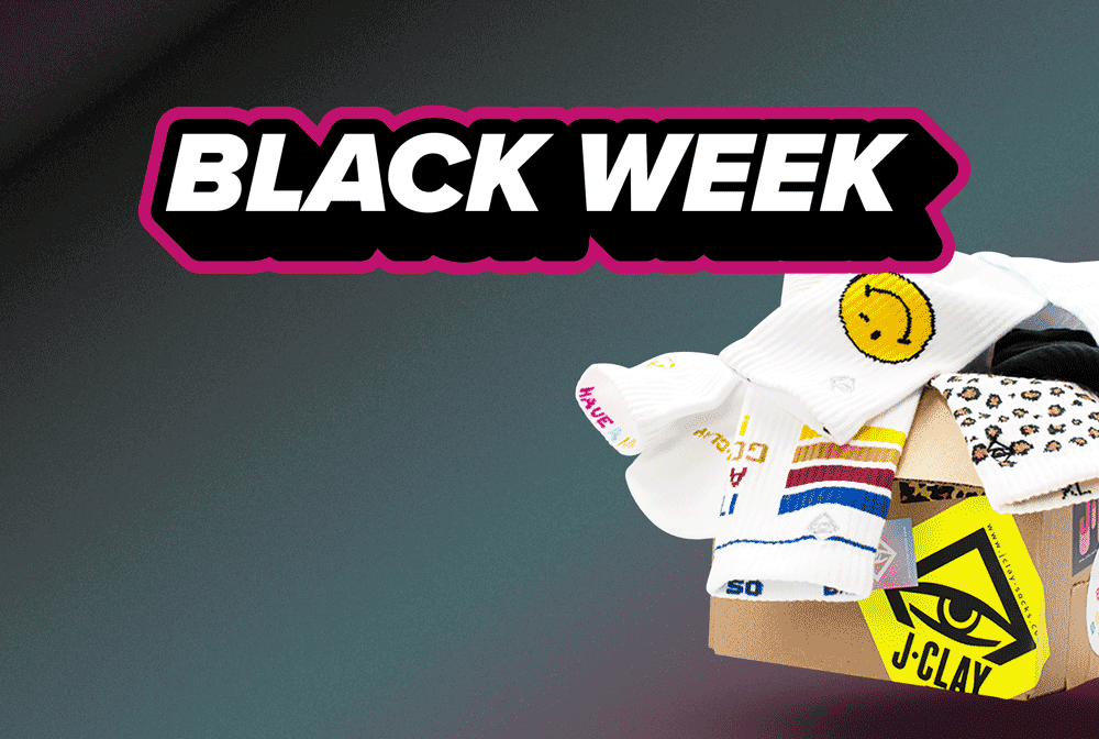 Ein Black-Week-Sale-Banner mit fettgedrucktem Text über einer Box mit bunten Socken in verschiedenen Designs und Mustern.