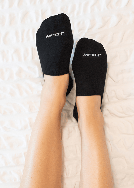 Schwarze Füßlinge - Pack