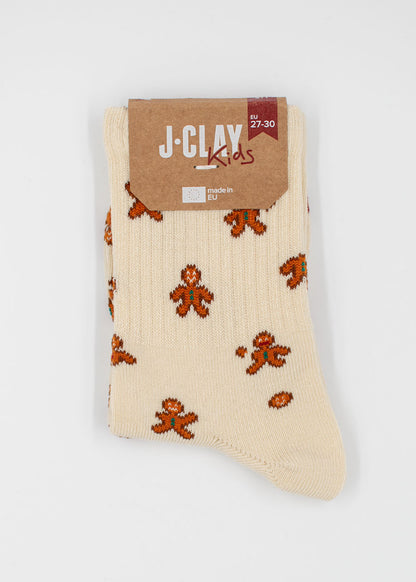 Cream Lebkuchenmann – Kindersocken mit einem braunen Lebkuchenmann-Muster für die Weihnachtszeit.