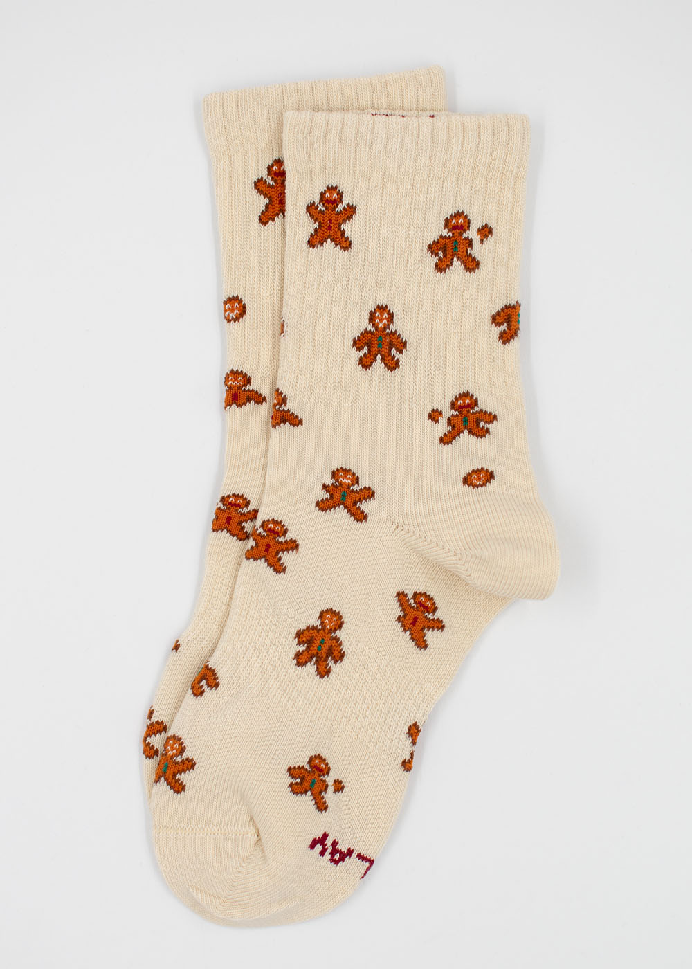 Cremefarbene Lebkuchenmann-Socken – Kindersocken mit durchgehendem Lebkuchenmann-Muster.