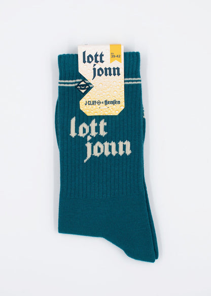 J.Clay Lott Jonn 2.0 Socken in der Farbe „Teal“, im Mönchengladbacher Stil, mit gelb-weißem Etikett oben.
