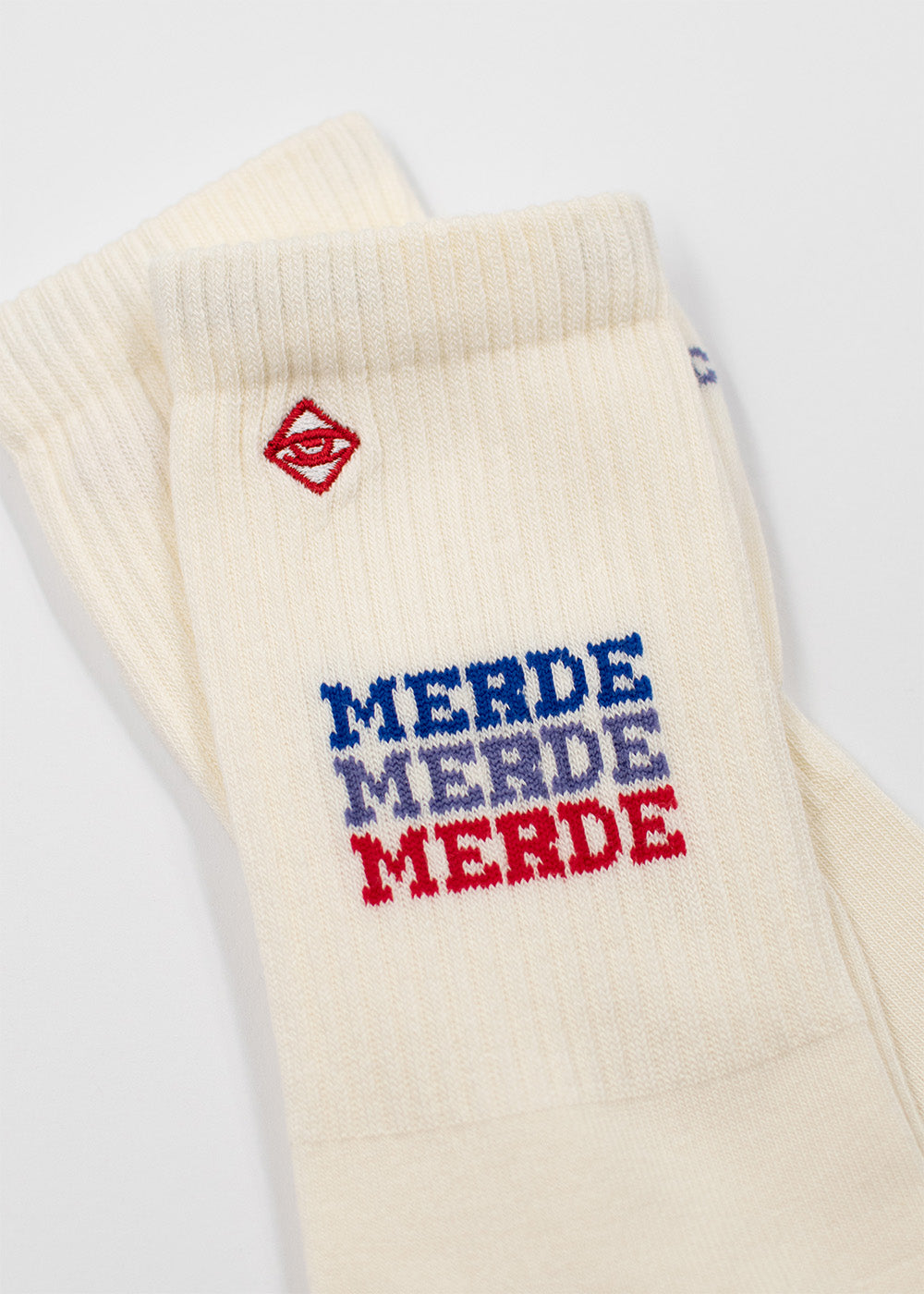 J.Clay Merde Merde: Weiße Statement-Socken mit "MERDE" in 3 Farben für deinen Style.