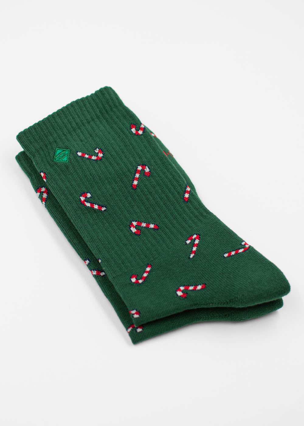 Dunkelgrüne J.Clay Candy Cane – Weihnachtssocken mit einem sich wiederholenden Zuckerstangenmuster.
