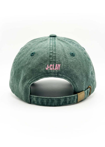 Sorry I'm late Green - Cap von J.Clay, grüner Denim mit rosa Stickerei über der Öffnung.