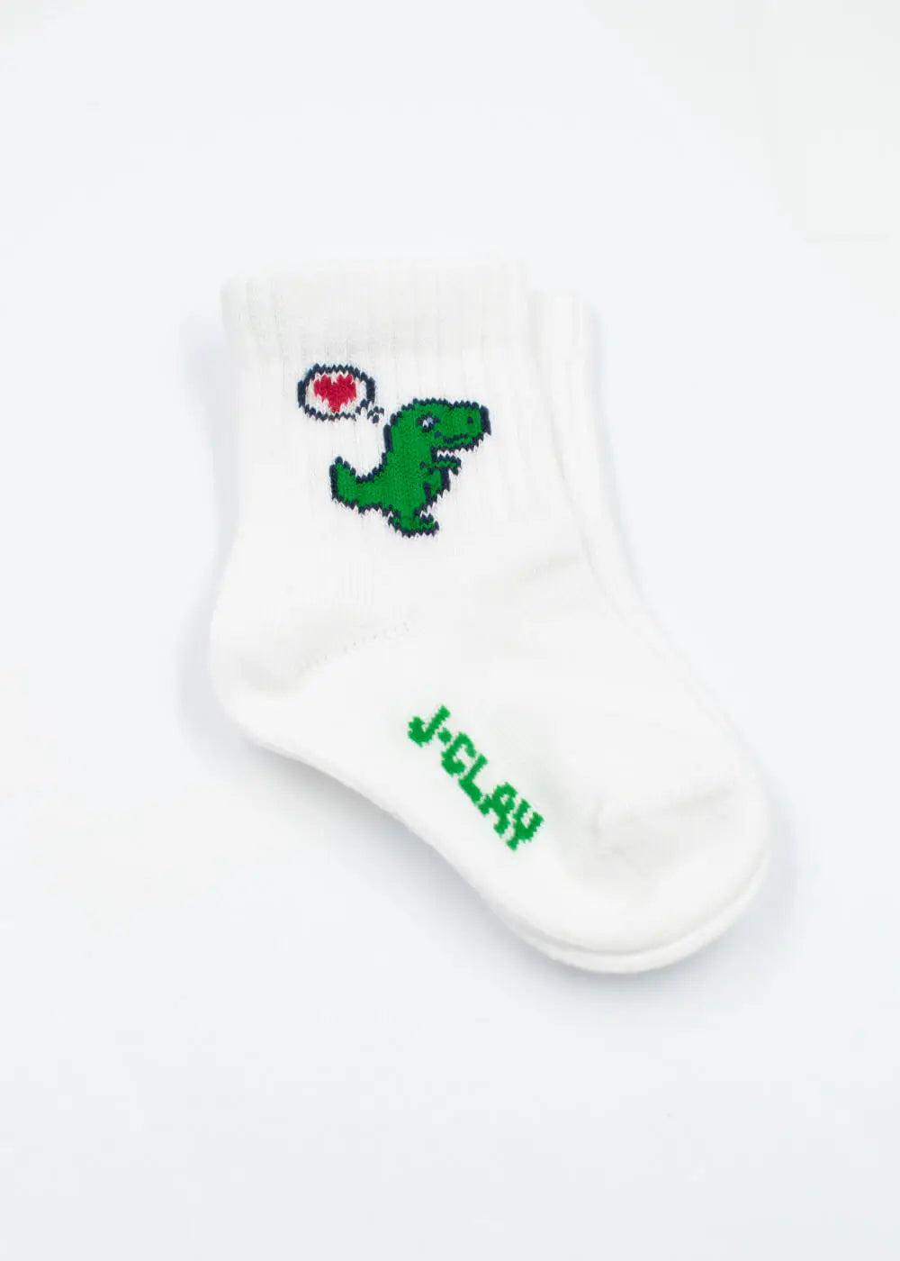 J.Clay Dino Love - Mini: Weiße Babysocken mit grünem Dino und roter Herz-Sprechblase.