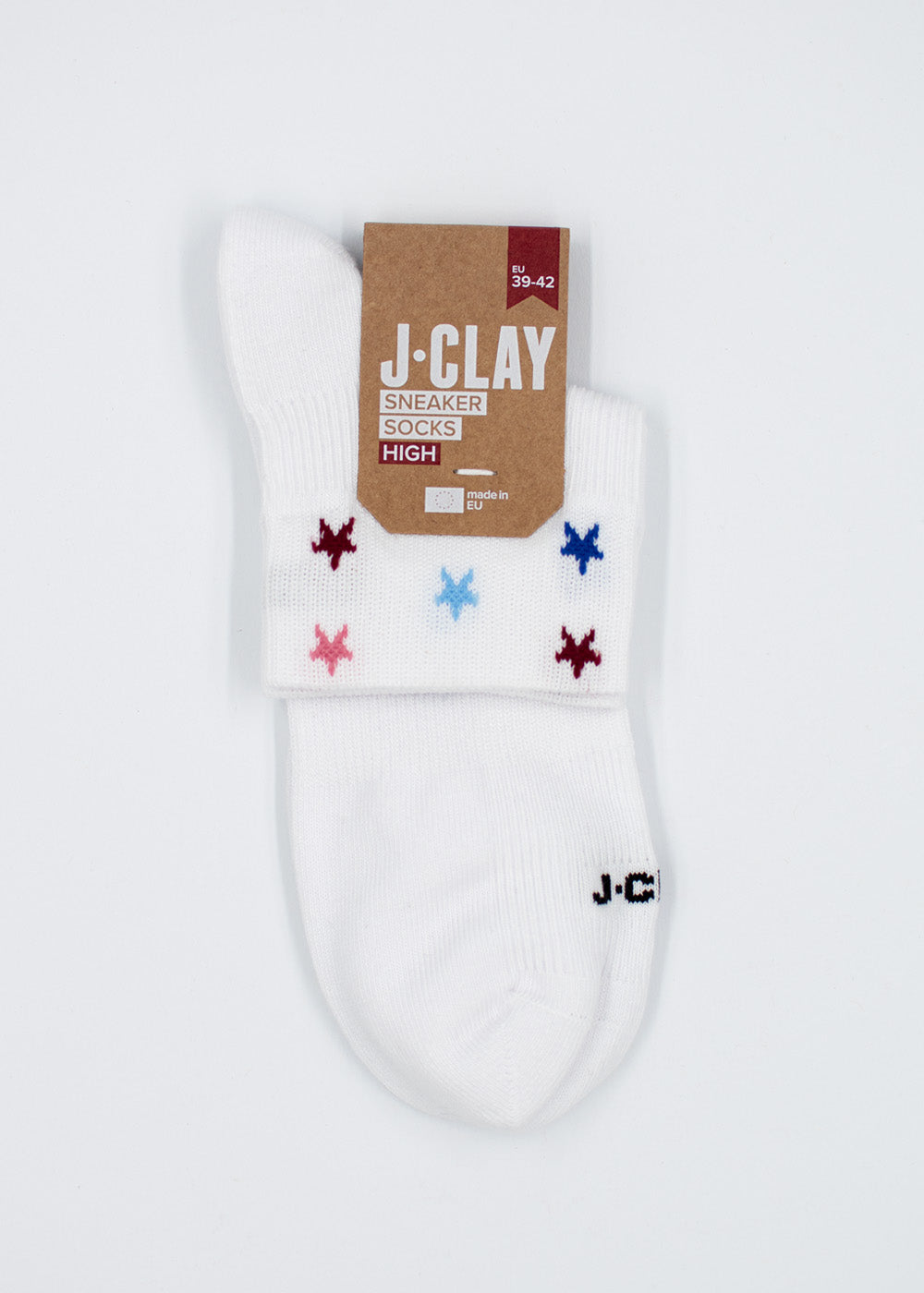 White Stars – SSH-Socken von J.Clay, mit farbigen Sternen, braunem Etikett und der Aufschrift „J.C.“ an der Zehenpartie.