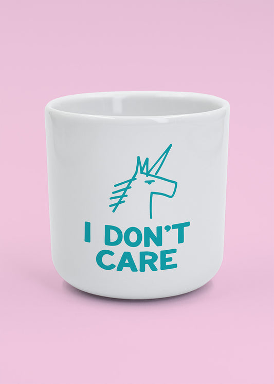 J.Clay „I don’t Care“ – Tasse: Weiße Tasse mit blauem Einhorn, perfekte Geschenk-Tasse.